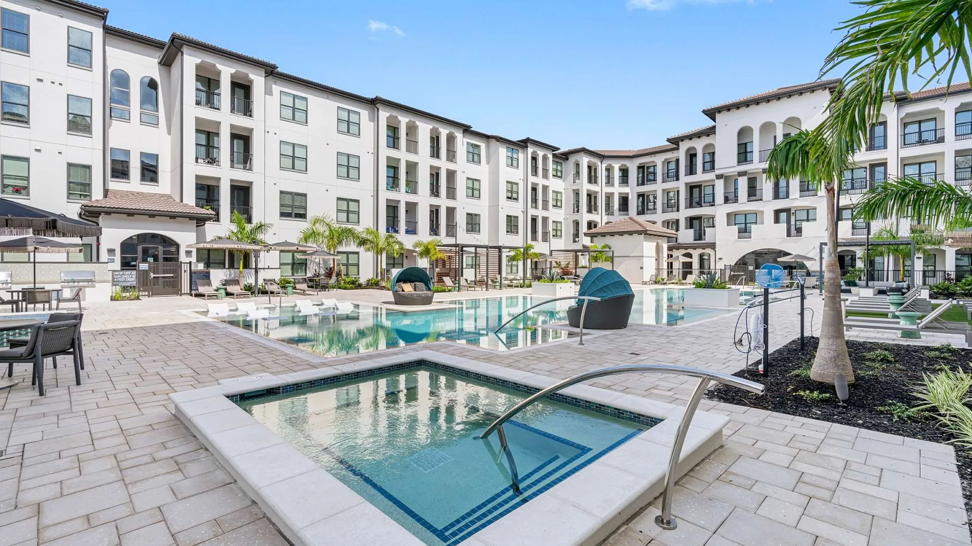 Community exterior and pool at Cortland ChampionsGate in Davenport, Florida